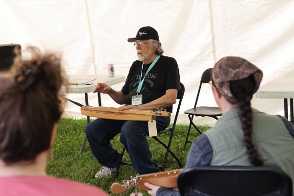 Paul demonstrating Appalachian dulcimers at the Central Ohio Folk Festival.